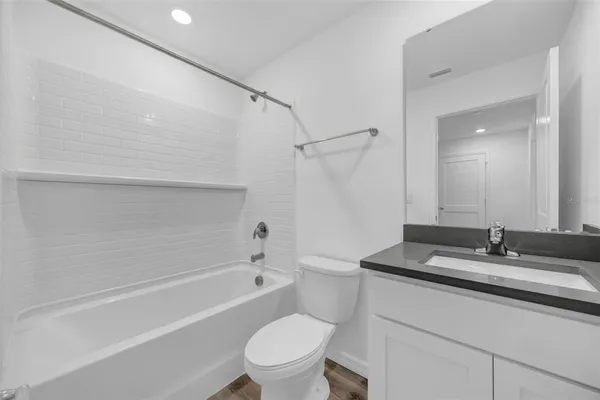 a bathroom with a shower and a toilet