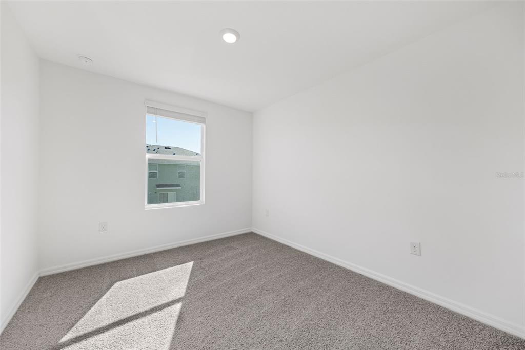 1009 Spotted Egret Loop Ruskin, FL 33570 - Photo 26 of 33 an empty room with a window