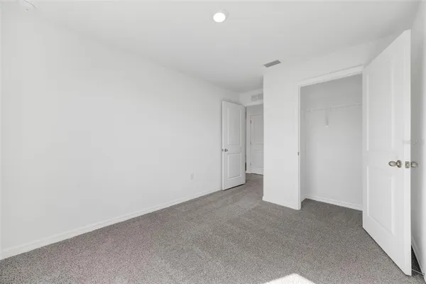 a view of a swimming pool with a lounge chairs