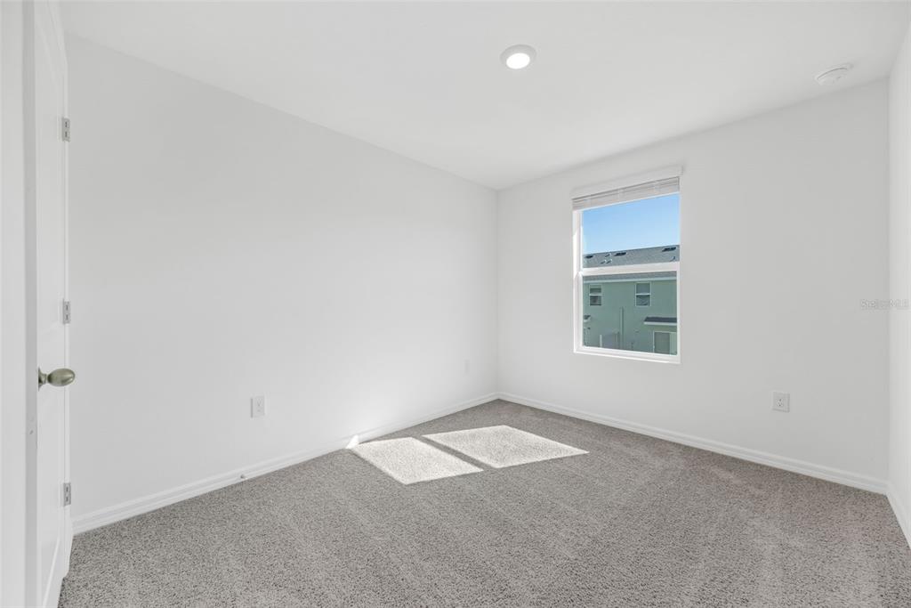 1009 Spotted Egret Loop Ruskin, FL 33570 - Photo 29 of 33 an empty room with a empty space and window