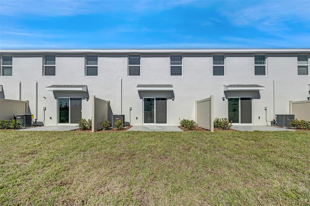 1009 Spotted Egret Loop Ruskin, FL 33570 - Photo 33 of 33 front view of a building with a yard