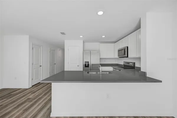 a kitchen with sink and window