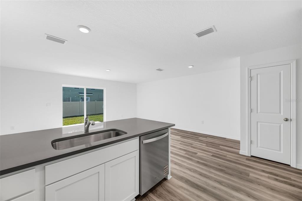 1009 Spotted Egret Loop Ruskin, FL 33570 - Photo 9 of 33 a kitchen with sink and window