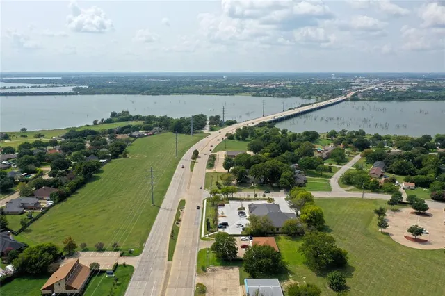 an aerial view of a city and lake view