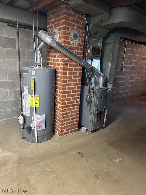751 Thayer Street, Unit DOWN Akron, OH 44310 - Photo 18 of 25 Utility room featuring water heater and heating unit