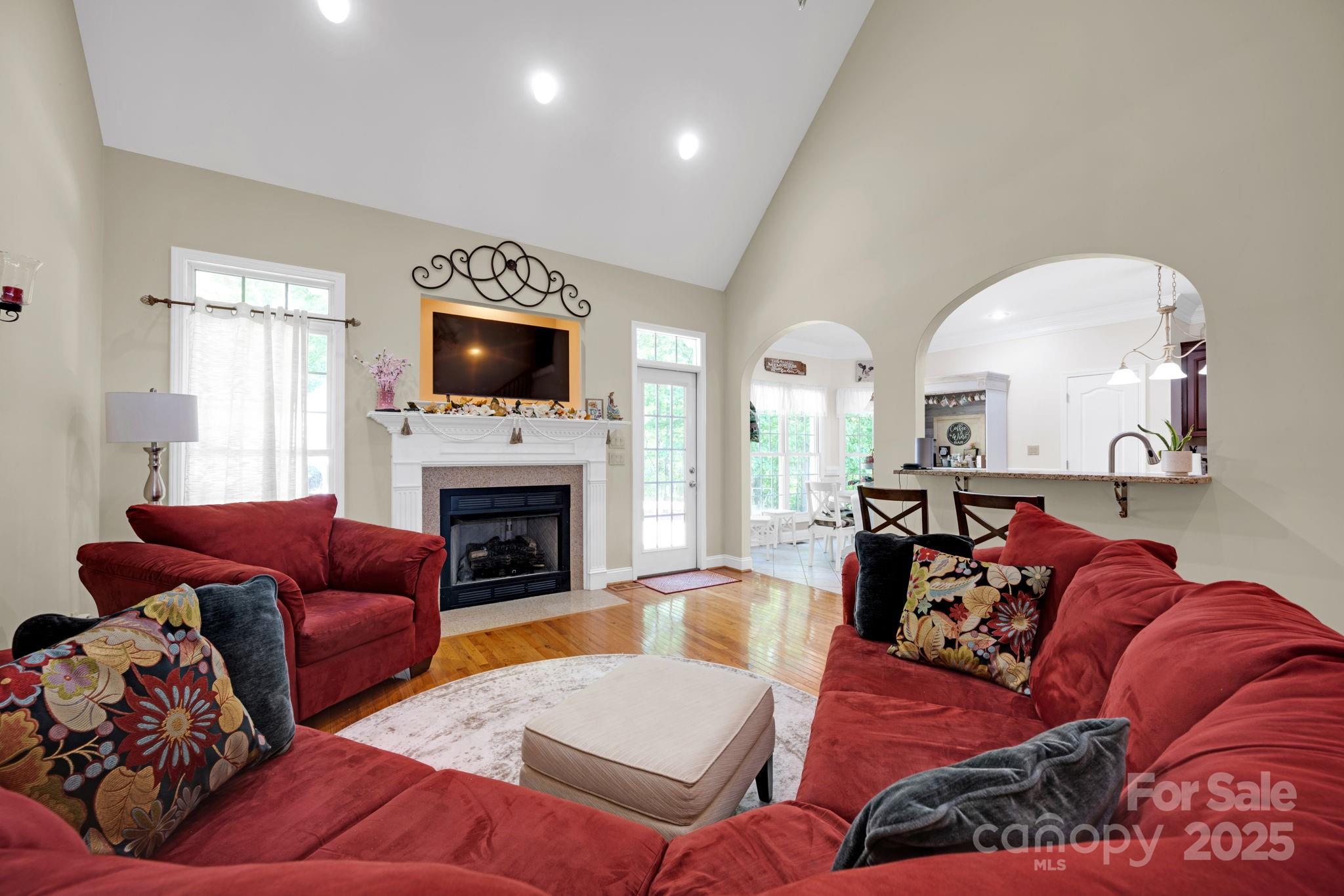 3610 Providence Mill Road Maiden, NC 28650 - Photo 11 of 44 a living room with furniture fireplace and a flat screen tv