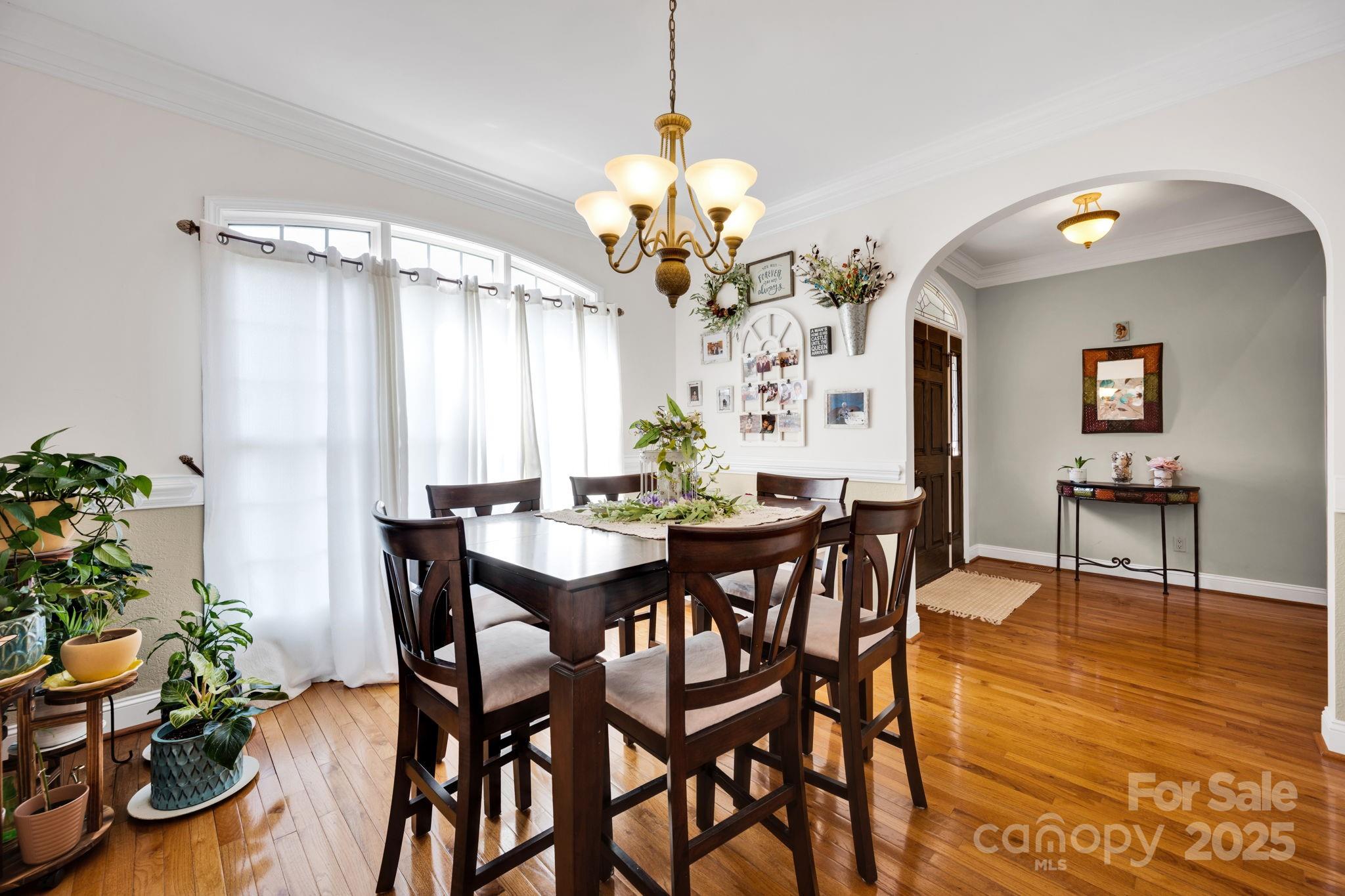 3610 Providence Mill Road Maiden, NC 28650 - Photo 15 of 44 a view of a dining room with furniture and a chandelier