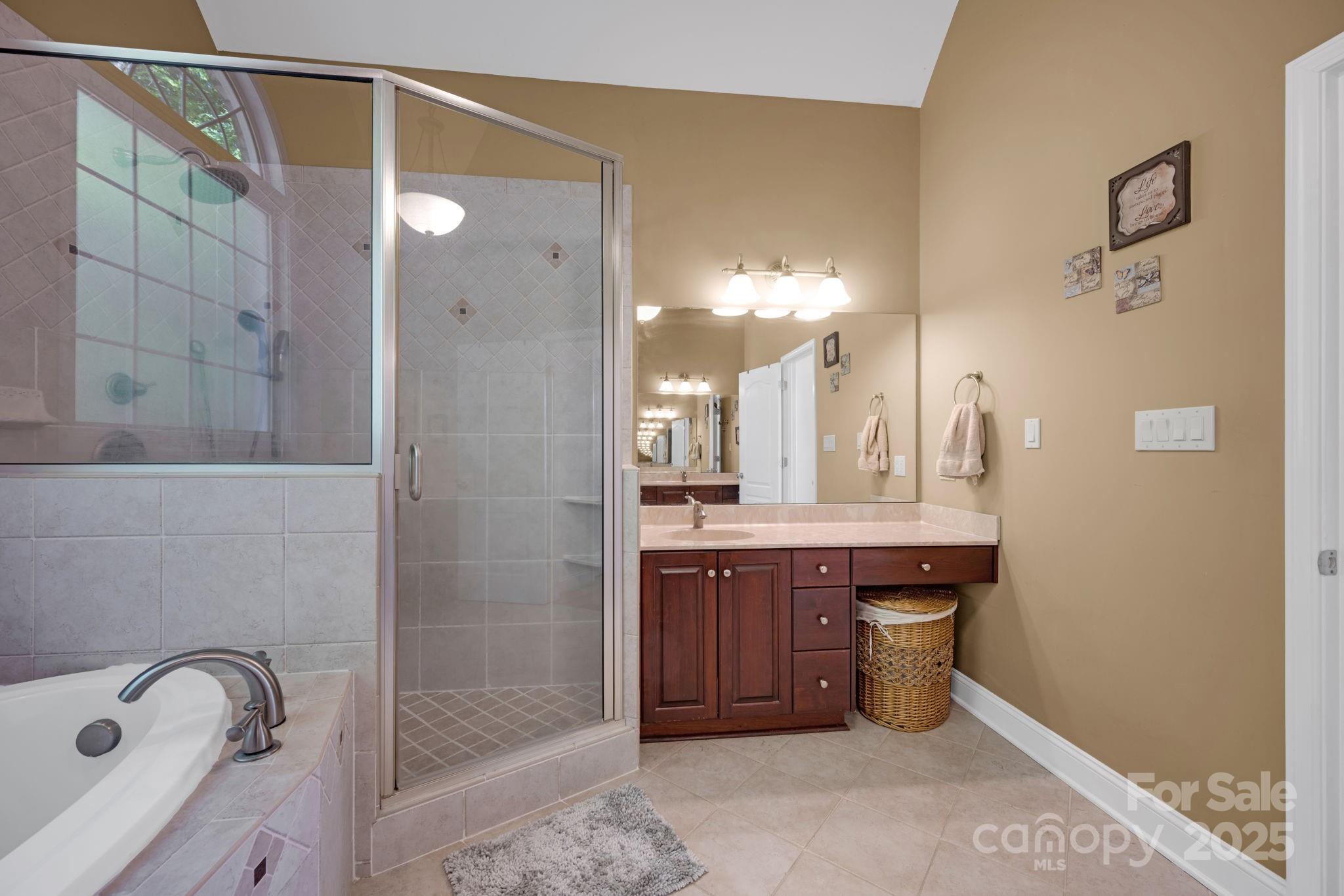 3610 Providence Mill Road Maiden, NC 28650 - Photo 20 of 44 a bathroom with a tub a sink shower and mirror