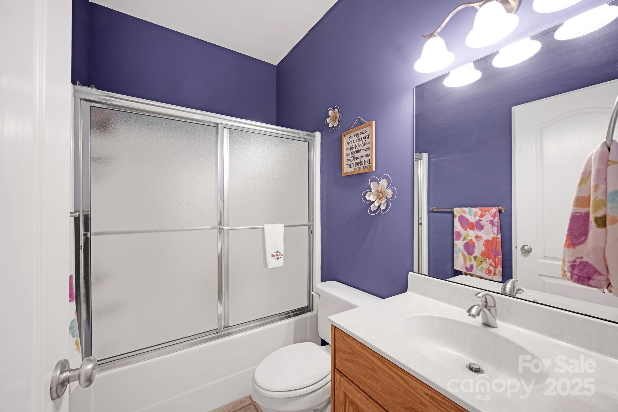 3610 Providence Mill Road Maiden, NC 28650 - Photo 24 of 44 a bathroom with a sink vanity mirror and toilet