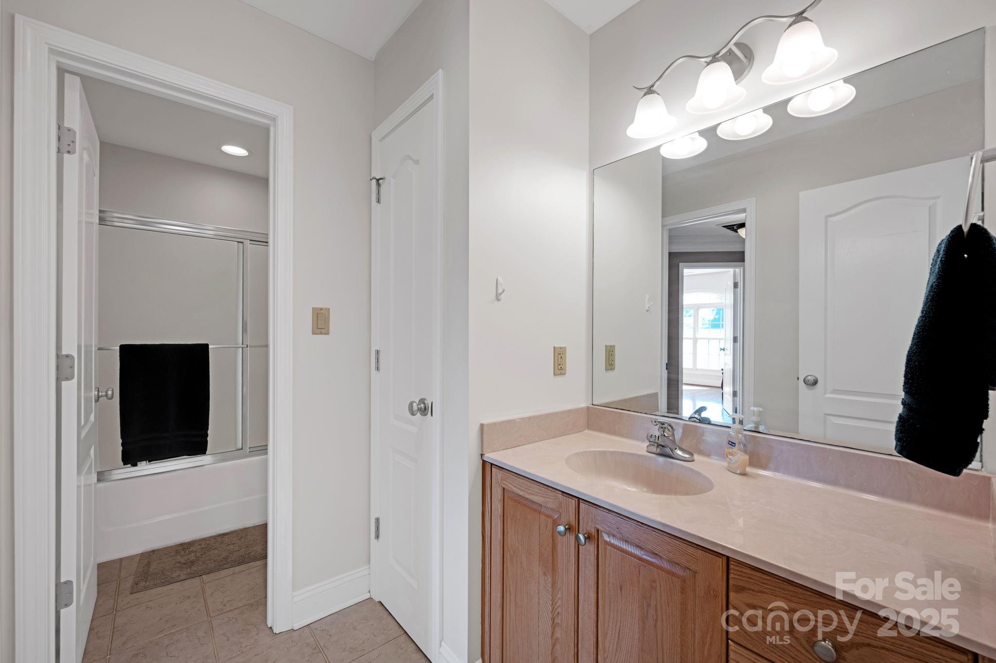 3610 Providence Mill Road Maiden, NC 28650 - Photo 30 of 44 a bathroom with a sink vanity and a mirror