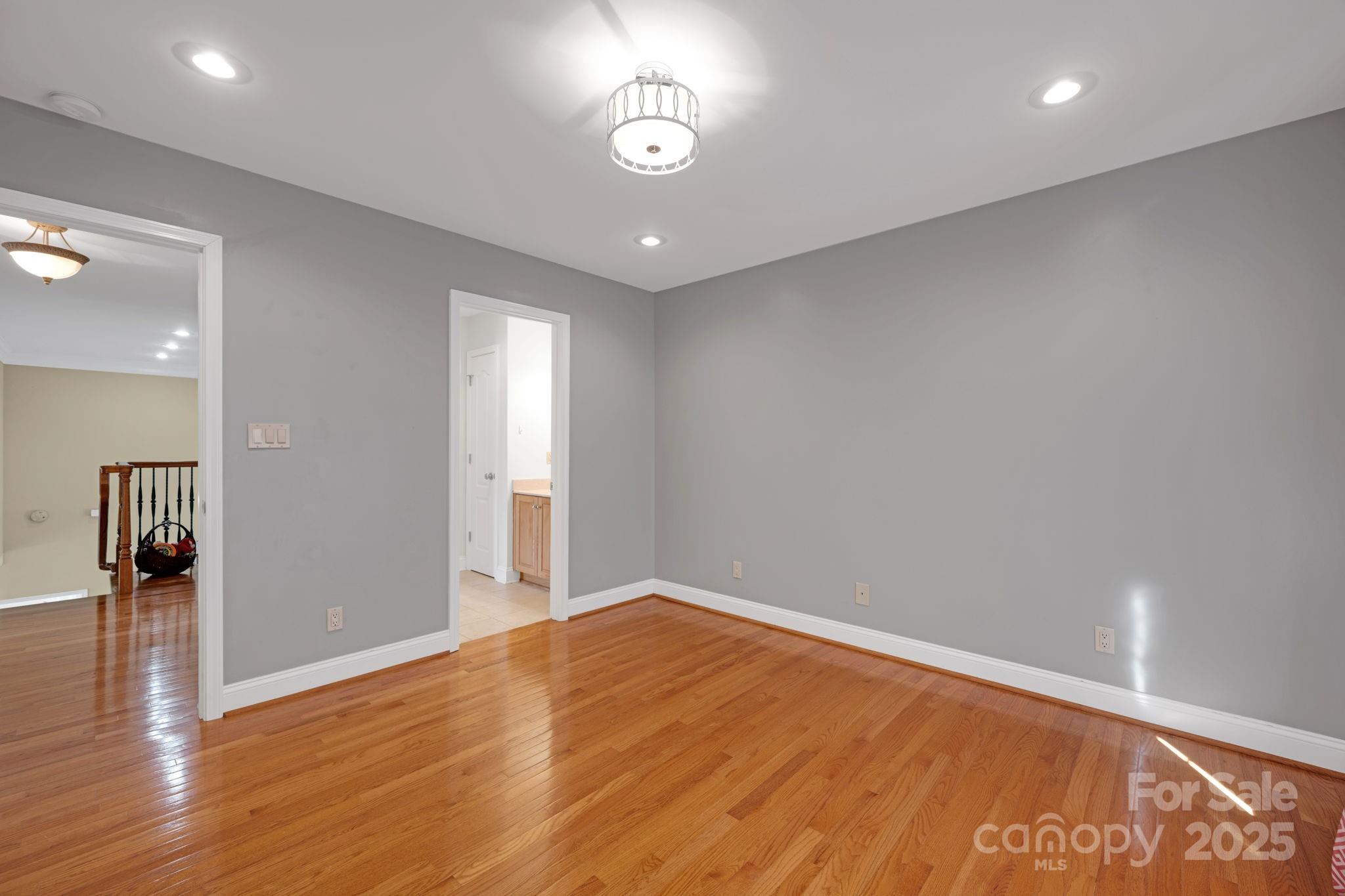 3610 Providence Mill Road Maiden, NC 28650 - Photo 33 of 44 an empty room with wooden floor and windows