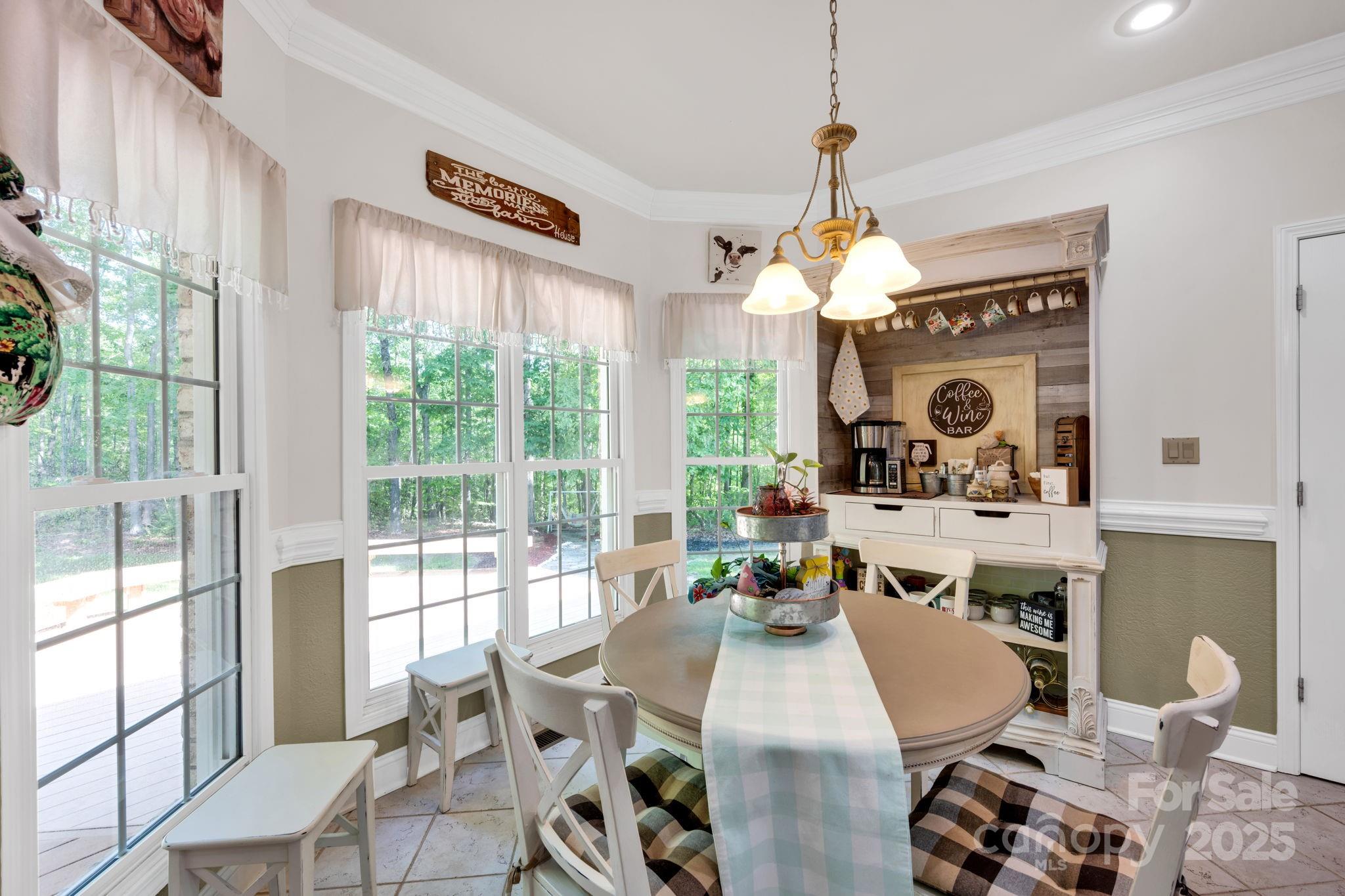 3610 Providence Mill Road Maiden, NC 28650 - Photo 8 of 44 a living room with furniture a window and a chandelier