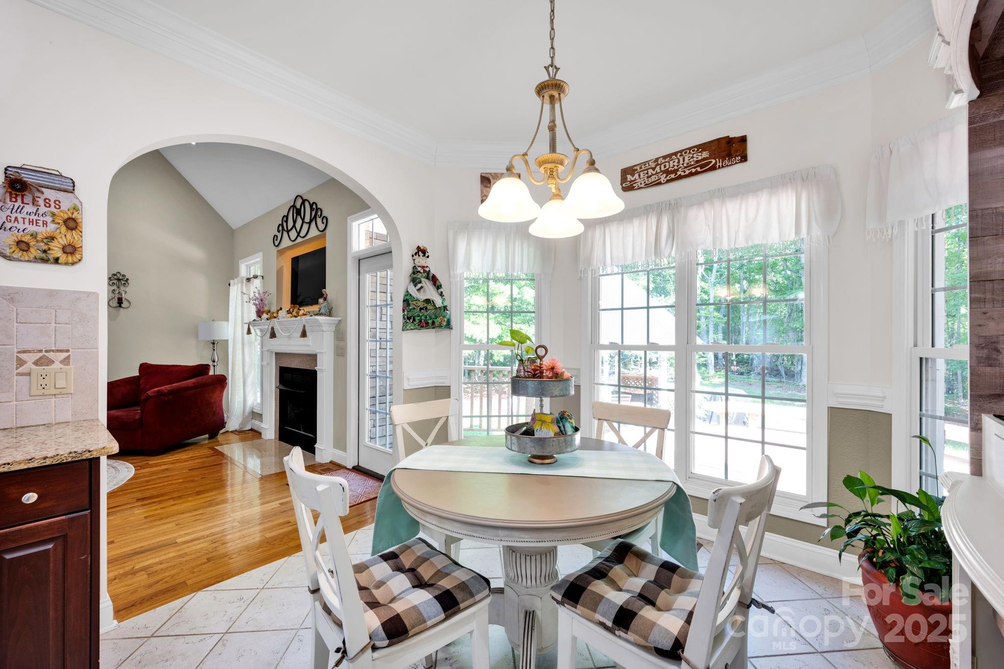 3610 Providence Mill Road Maiden, NC 28650 - Photo 9 of 44 a living room with fireplace furniture and a chandelier