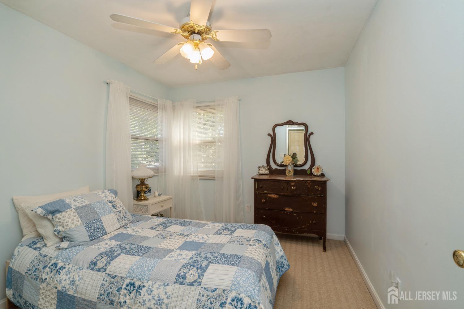 22 Constable Road Kendall Park, NJ 08824 - Photo 13 of 32 a bedroom with a bed and a dresser