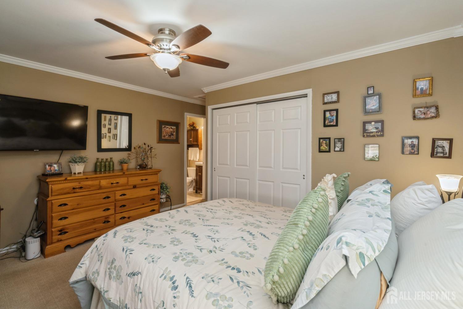 22 Constable Road Kendall Park, NJ 08824 - Photo 19 of 32 a bedroom with a bed and a flat screen tv