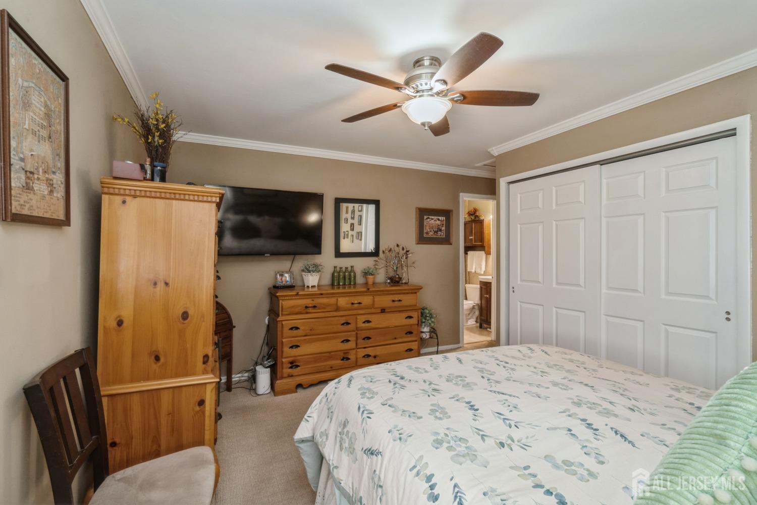 22 Constable Road Kendall Park, NJ 08824 - Photo 20 of 32 a bedroom with a bed and a flat screen tv