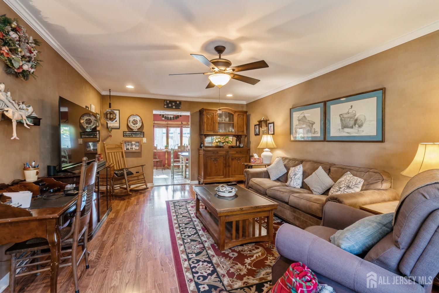 22 Constable Road Kendall Park, NJ 08824 - Photo 22 of 32 a living room with furniture and wooden floor