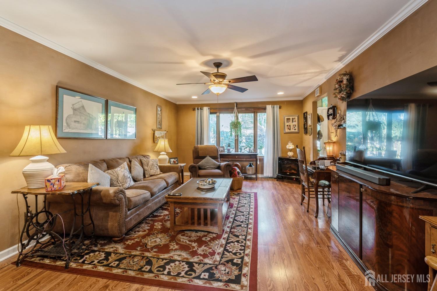 22 Constable Road Kendall Park, NJ 08824 - Photo 23 of 32 a living room with furniture and a wooden floor