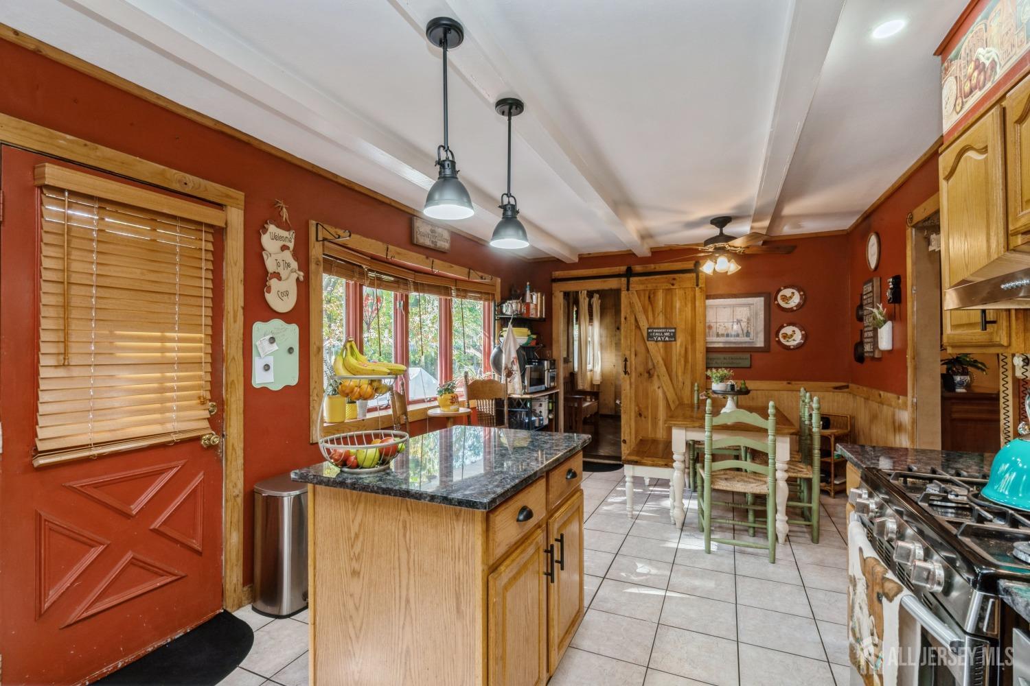 22 Constable Road Kendall Park, NJ 08824 - Photo 29 of 32 a kitchen with stainless steel appliances granite countertop a sink and a refrigerator