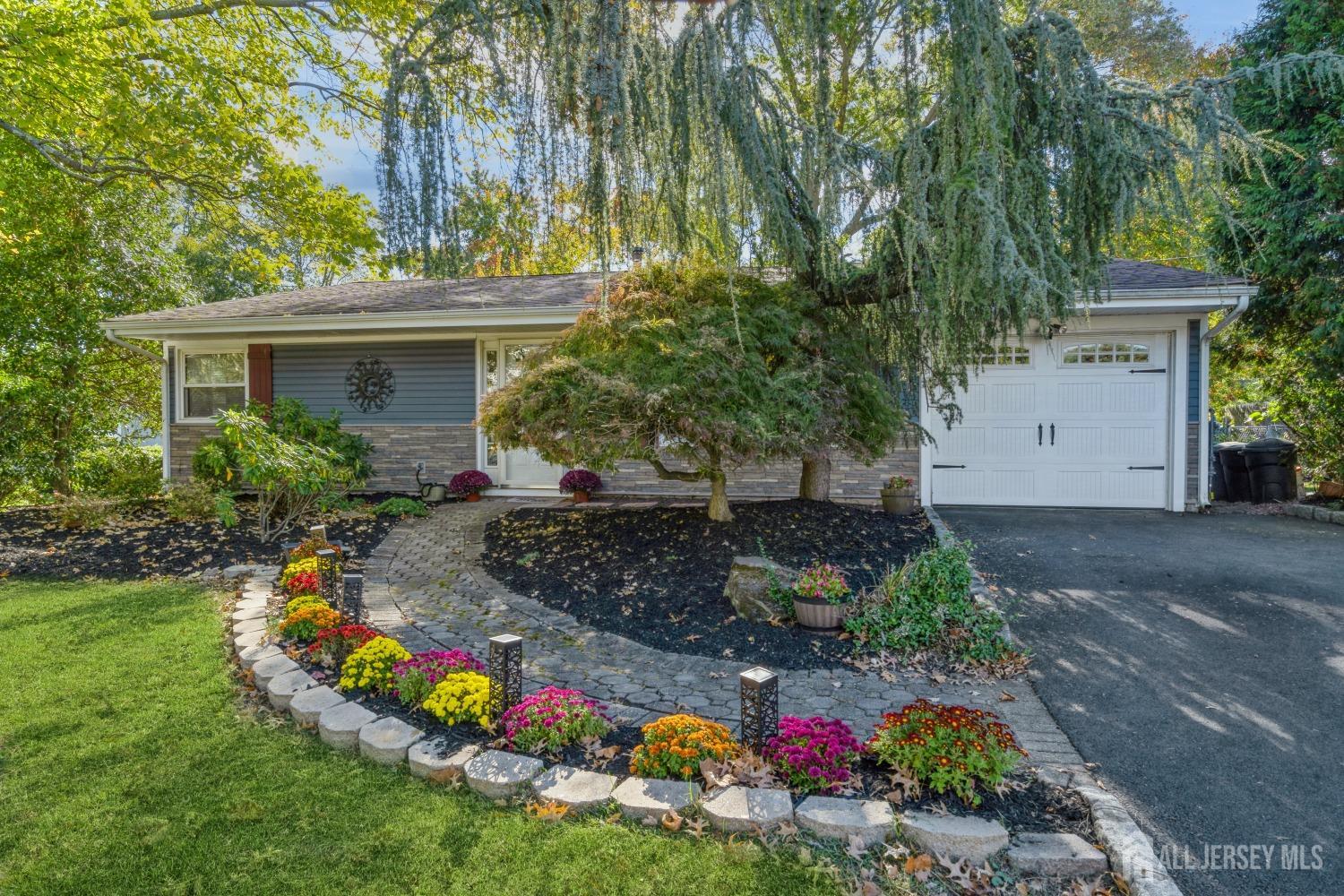 22 Constable Road Kendall Park, NJ 08824 - Photo 3 of 32 a front view of house with yard and trees