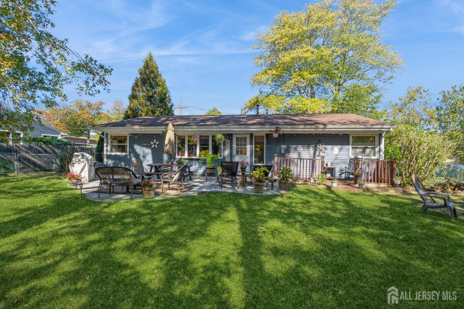 22 Constable Road Kendall Park, NJ 08824 - Photo 6 of 32 a view of a house with a yard porch and sitting area