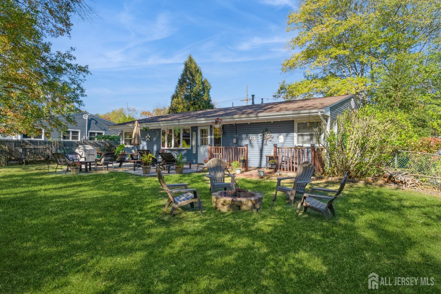 22 Constable Road Kendall Park, NJ 08824 - Photo 7 of 32 a view of a house with a yard porch and sitting area