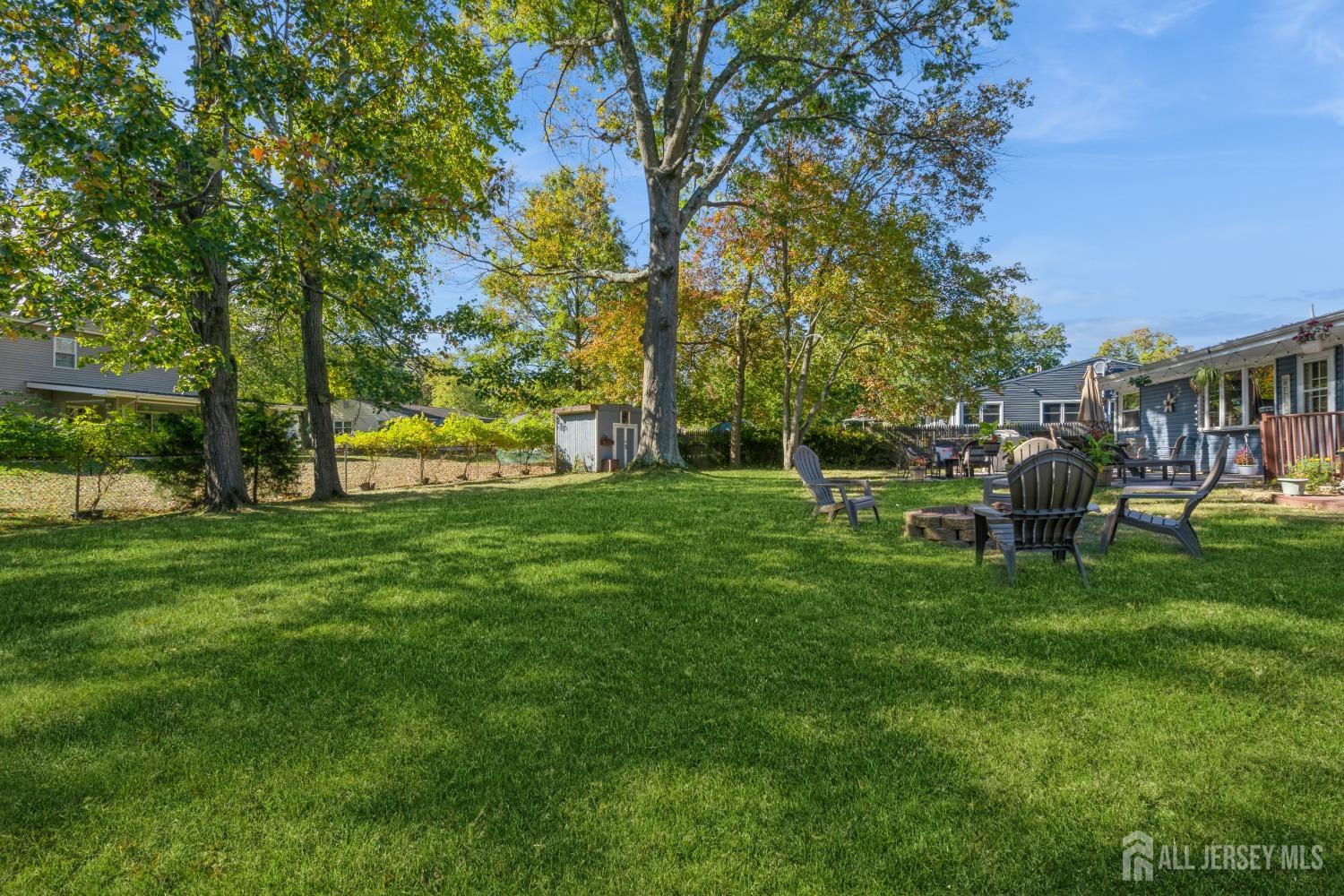 22 Constable Road Kendall Park, NJ 08824 - Photo 8 of 32 a chair and table in the garden