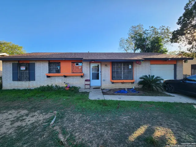 a house view with a garden space