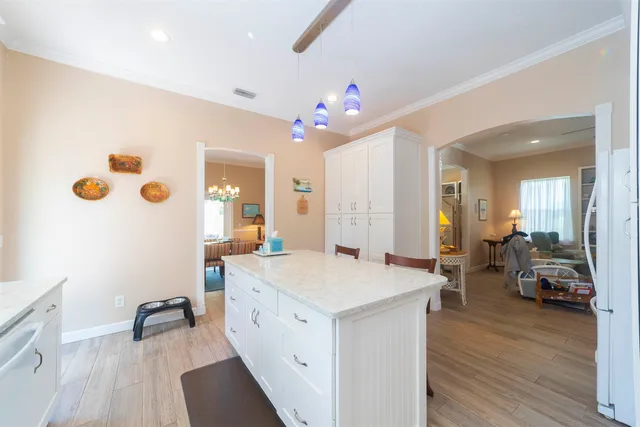 a view of living room with granite countertop furniture and wooden floor