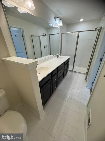 a bathroom with a sink toilet and mirror