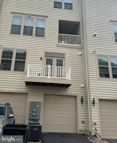 a view of a house with large windows