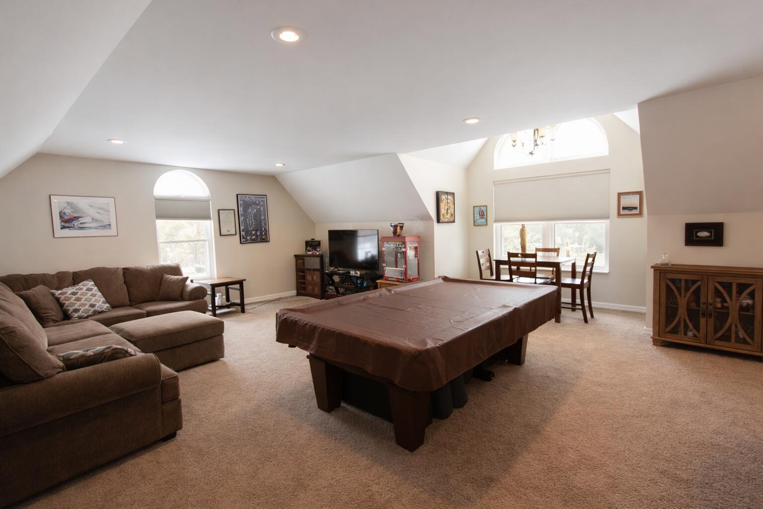 2688 North Goldring Road La Porte, IN 46350 - Photo 29 of 42 a living room with furniture a table and kitchen view