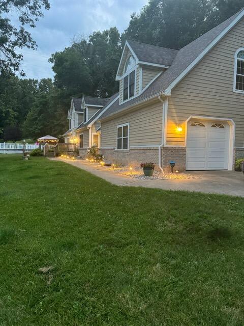 2688 North Goldring Road La Porte, IN 46350 - Photo 34 of 42 a backyard of a house with table and chairs