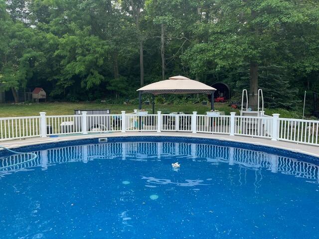 2688 North Goldring Road La Porte, IN 46350 - Photo 5 of 42 a view of house with a swimming pool and furniture