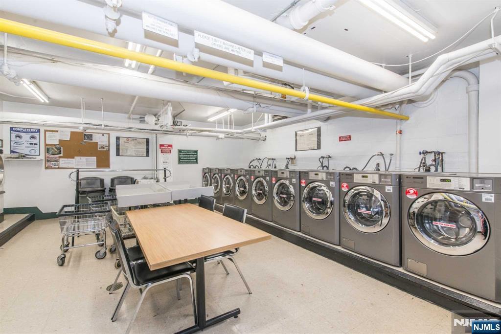 301 Beech Street, Unit 3DD Hackensack, NJ 07601 - Photo 11 of 16 a utility room with stainless steel appliances lots of clutter