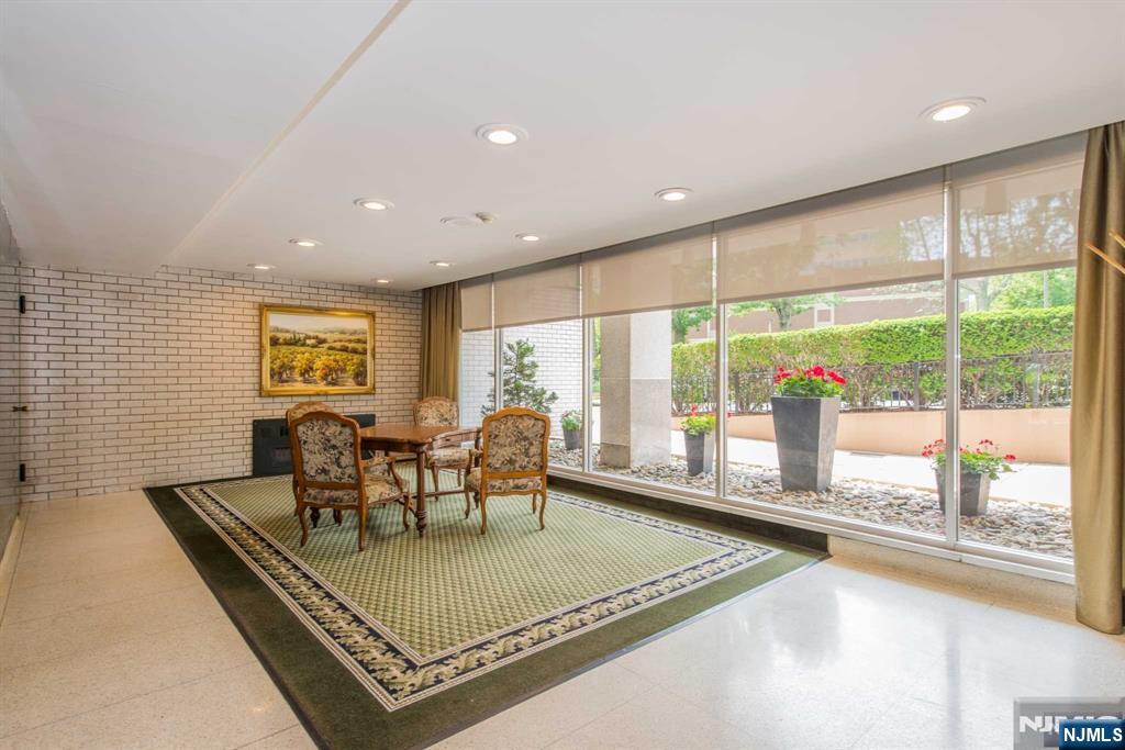 301 Beech Street, Unit 3DD Hackensack, NJ 07601 - Photo 3 of 16 a view of a living room and dining room