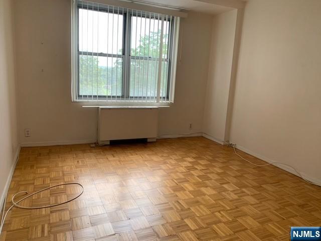 301 Beech Street, Unit 3DD Hackensack, NJ 07601 - Photo 9 of 16 a view of an empty room with a window