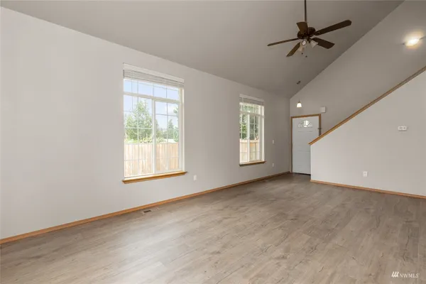 a view of an empty room with a window