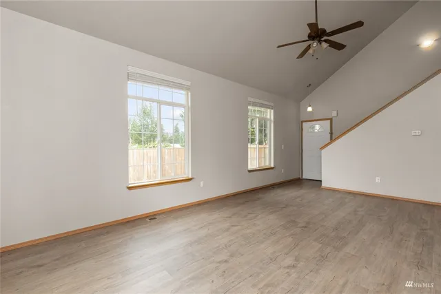 a view of an empty room with a window