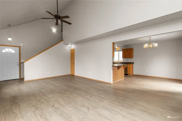 a view of a kitchen with a sink and a kitchen counter top space