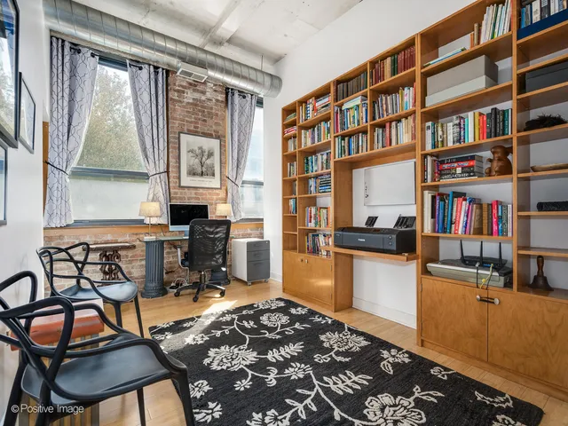 a room with furniture and a book shelf