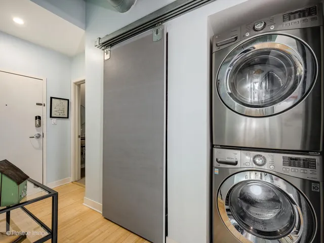 a view of a hallway with washer and dryer