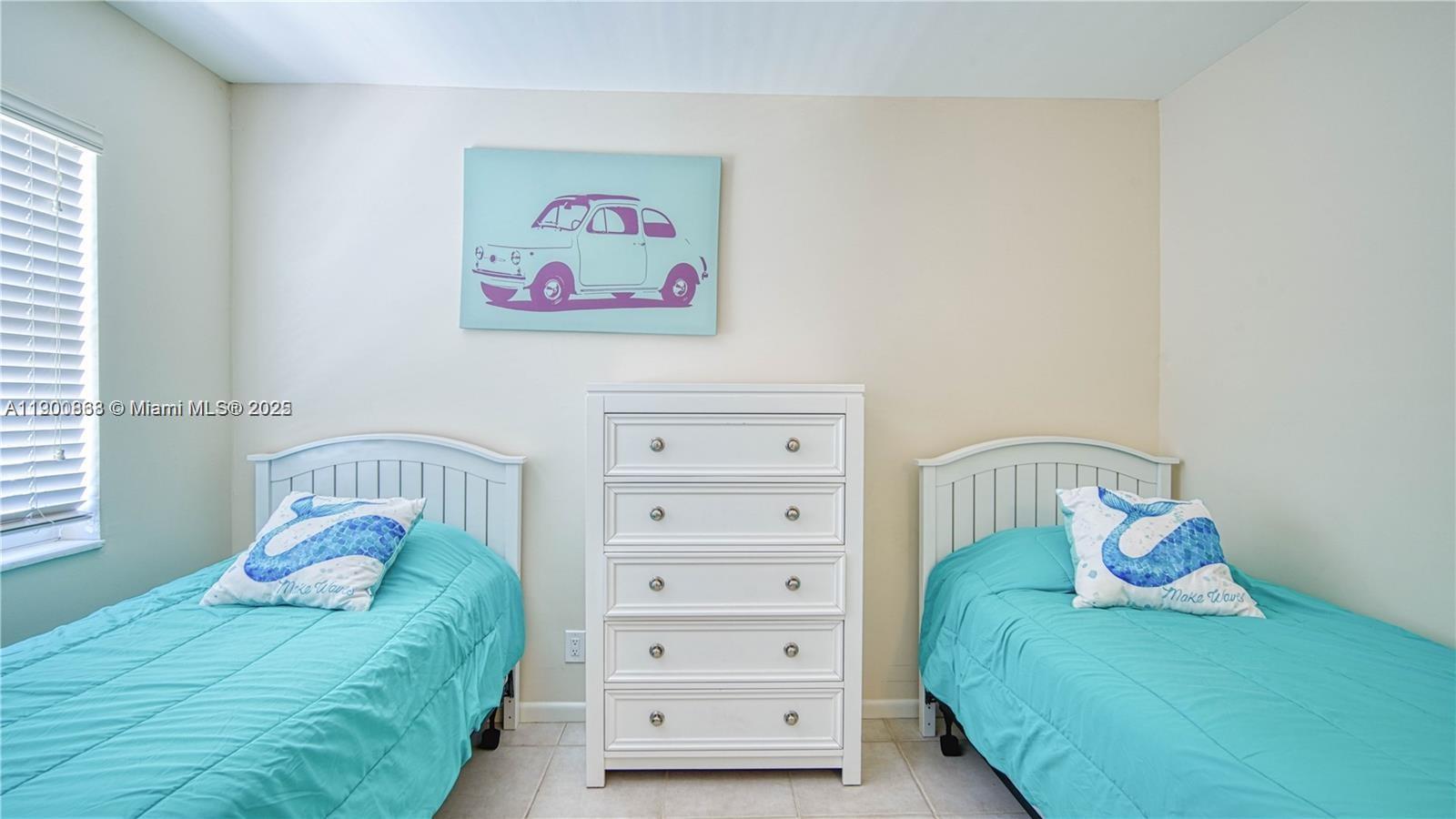 2900 Banyan Street, Unit 408 Fort Lauderdale, FL 33316 - Photo 14 of 29 a bedroom with a bed and a window