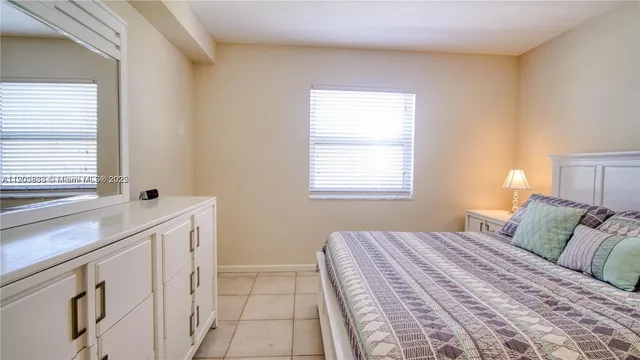 a bedroom with a sink and a window