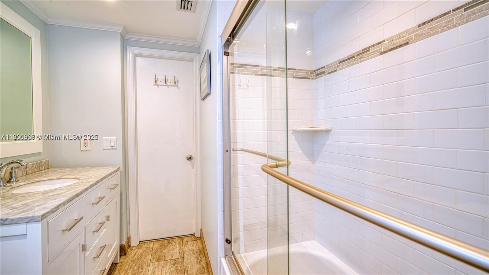 2900 Banyan Street, Unit 408 Fort Lauderdale, FL 33316 - Photo 21 of 29 a bathroom with a sink and a mirror