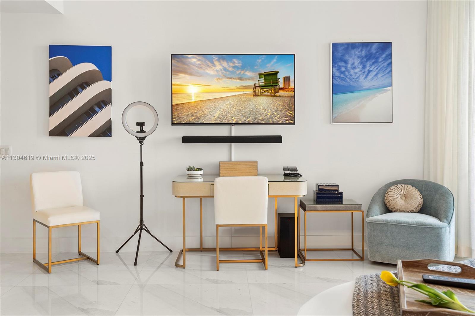 2201 Collins Avenue, Unit 1926/PH Miami Beach, FL 33139 - Photo 12 of 47 a living room with furniture and a flat screen tv