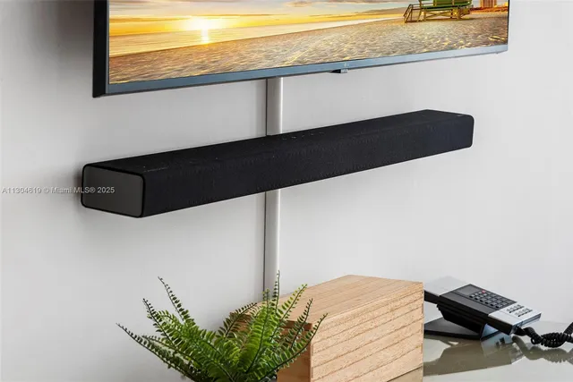 a living room with a bed and a window with outer view