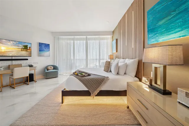 a bedroom with a bed and window