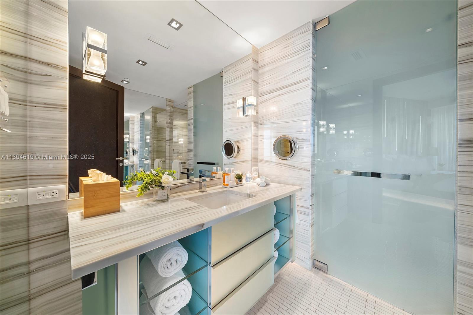 2201 Collins Avenue, Unit 1926/PH Miami Beach, FL 33139 - Photo 41 of 47 a bathroom with a sink double vanity and a mirror