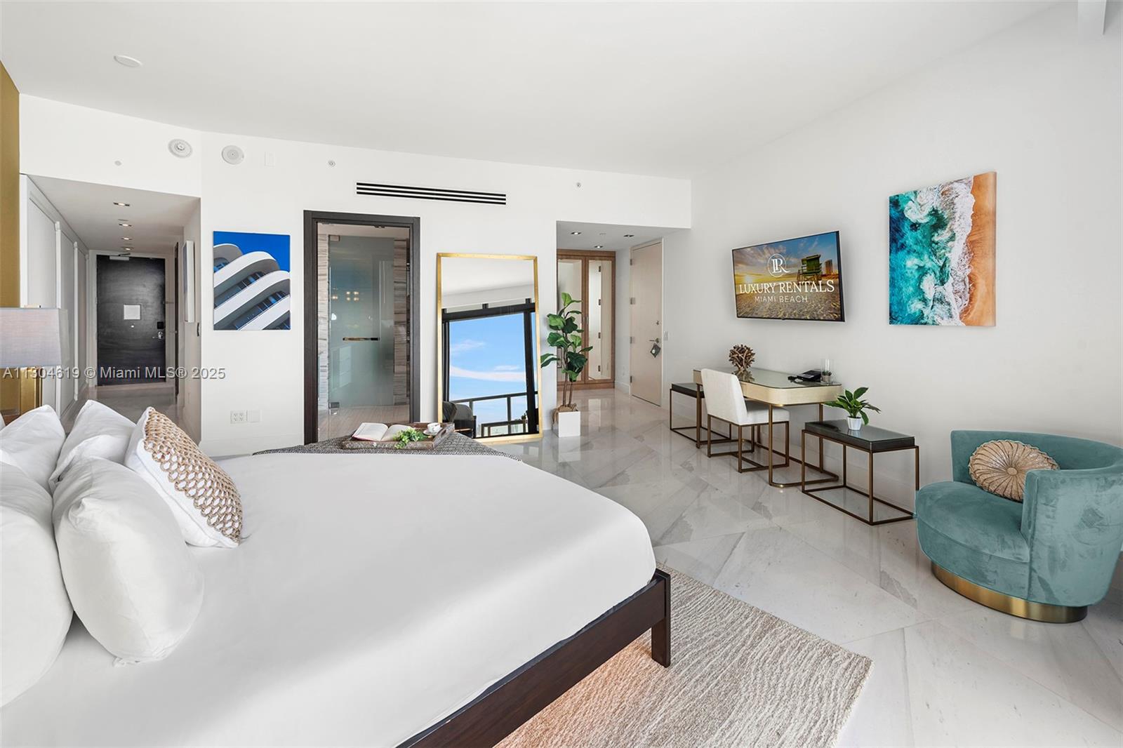 2201 Collins Avenue, Unit 1926/PH Miami Beach, FL 33139 - Photo 9 of 47 a bed room with a bed and a couch